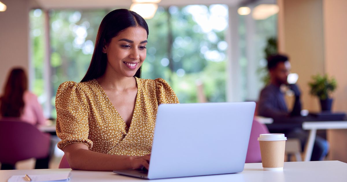 Woman typing on laptop